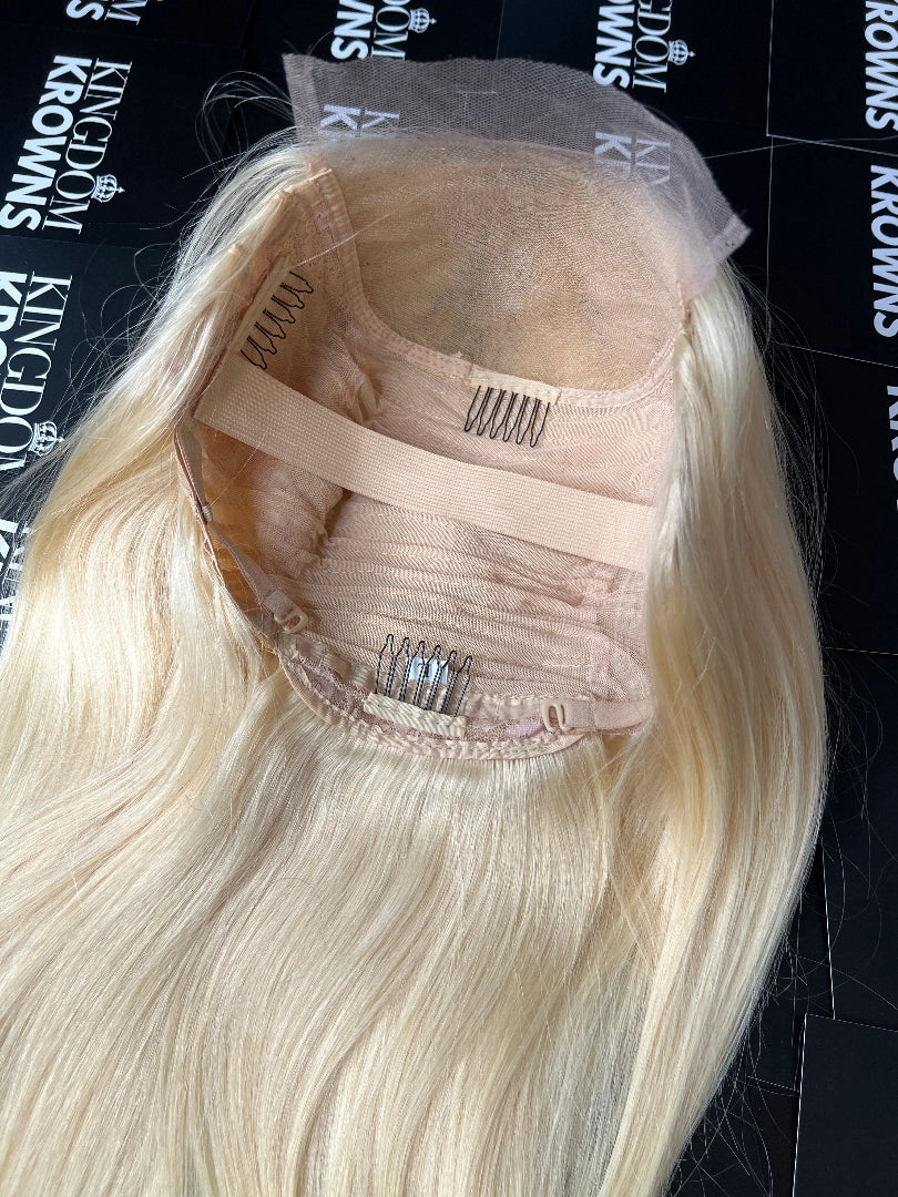 A blonde wig with straight texture.