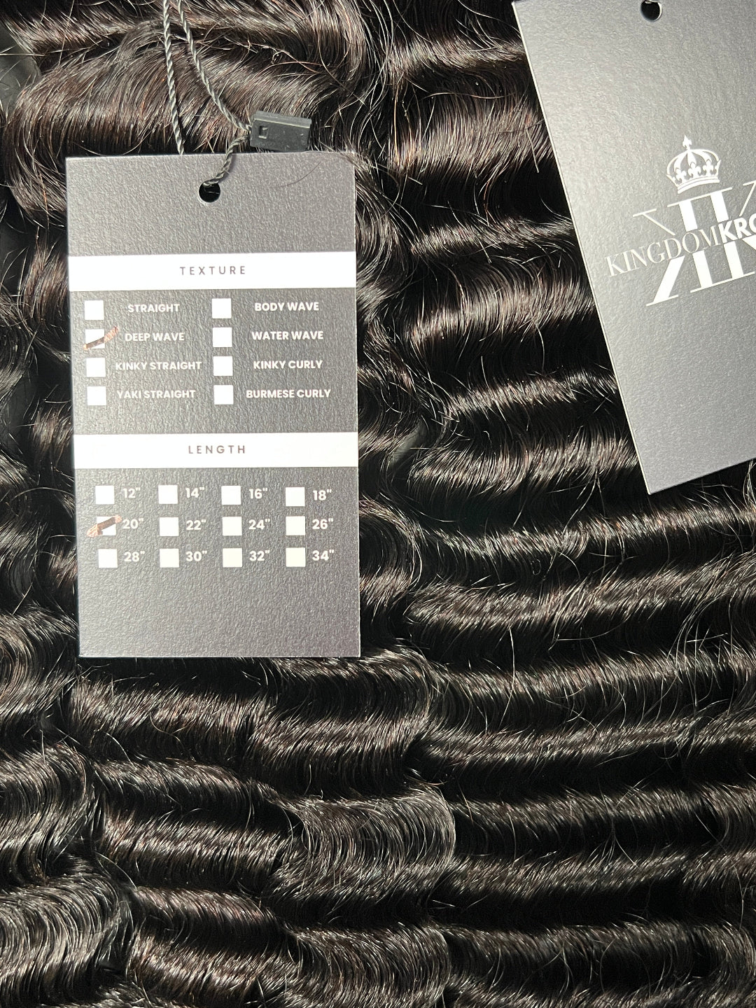Close-up of hair extensions with a label on a dark background