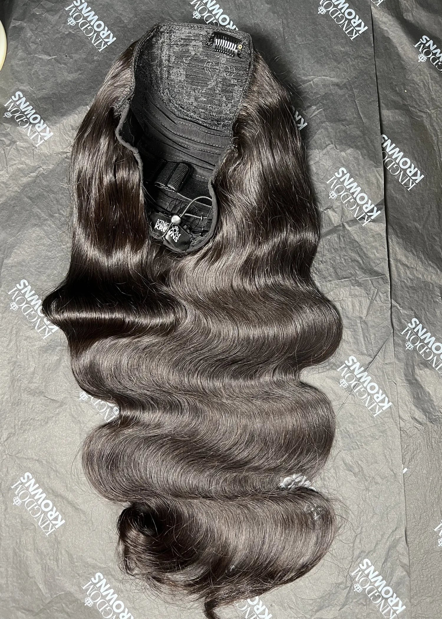 Hair extensions on a branded surface