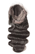 A close-up image of a natural black lace human hair wig with body wave texture.